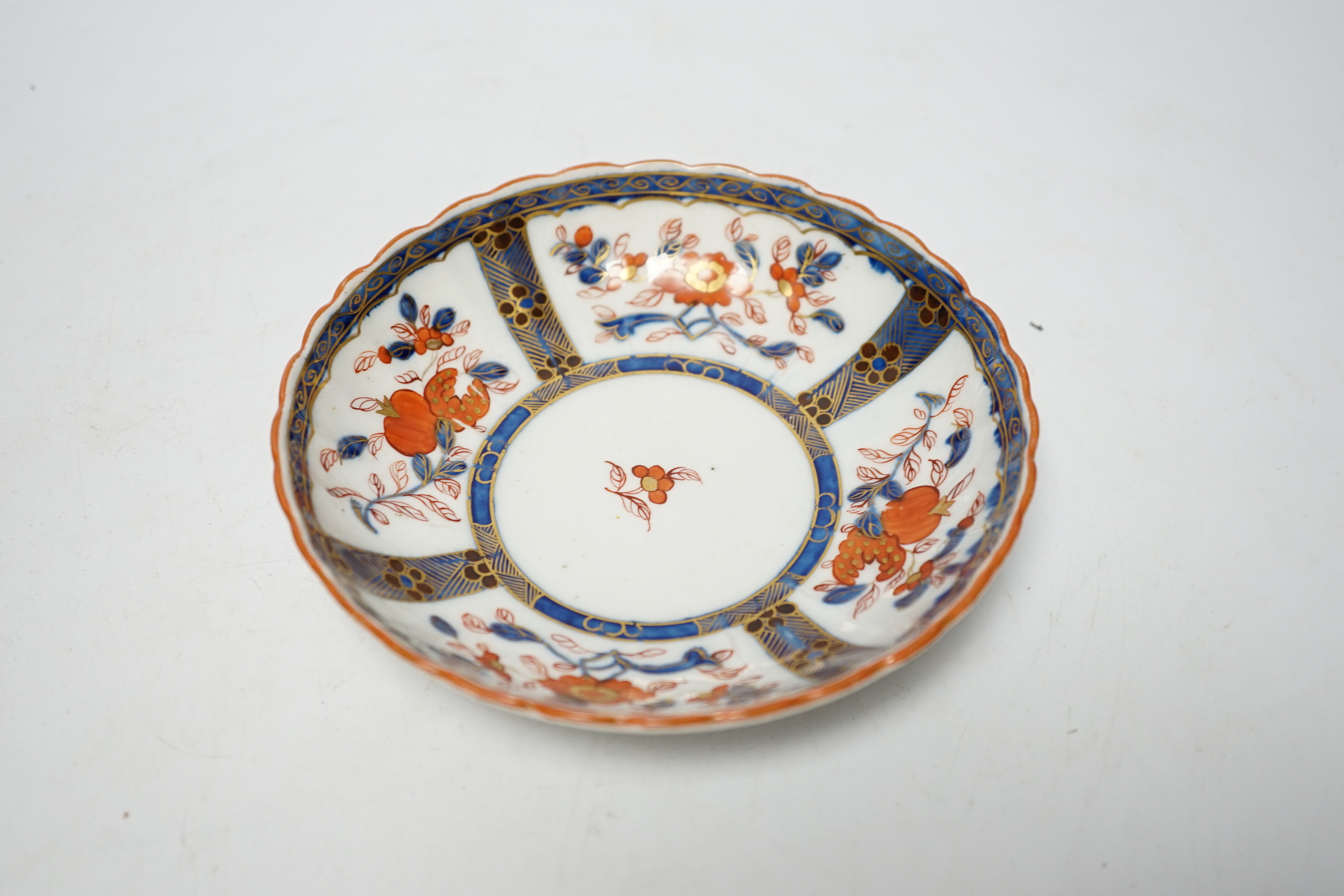 A Worcester ‘low Chelsea ewer’ milk jug, c.1770 and a Worcester Japan pattern coffee cup and saucer, c.1780, jug 6.5cm